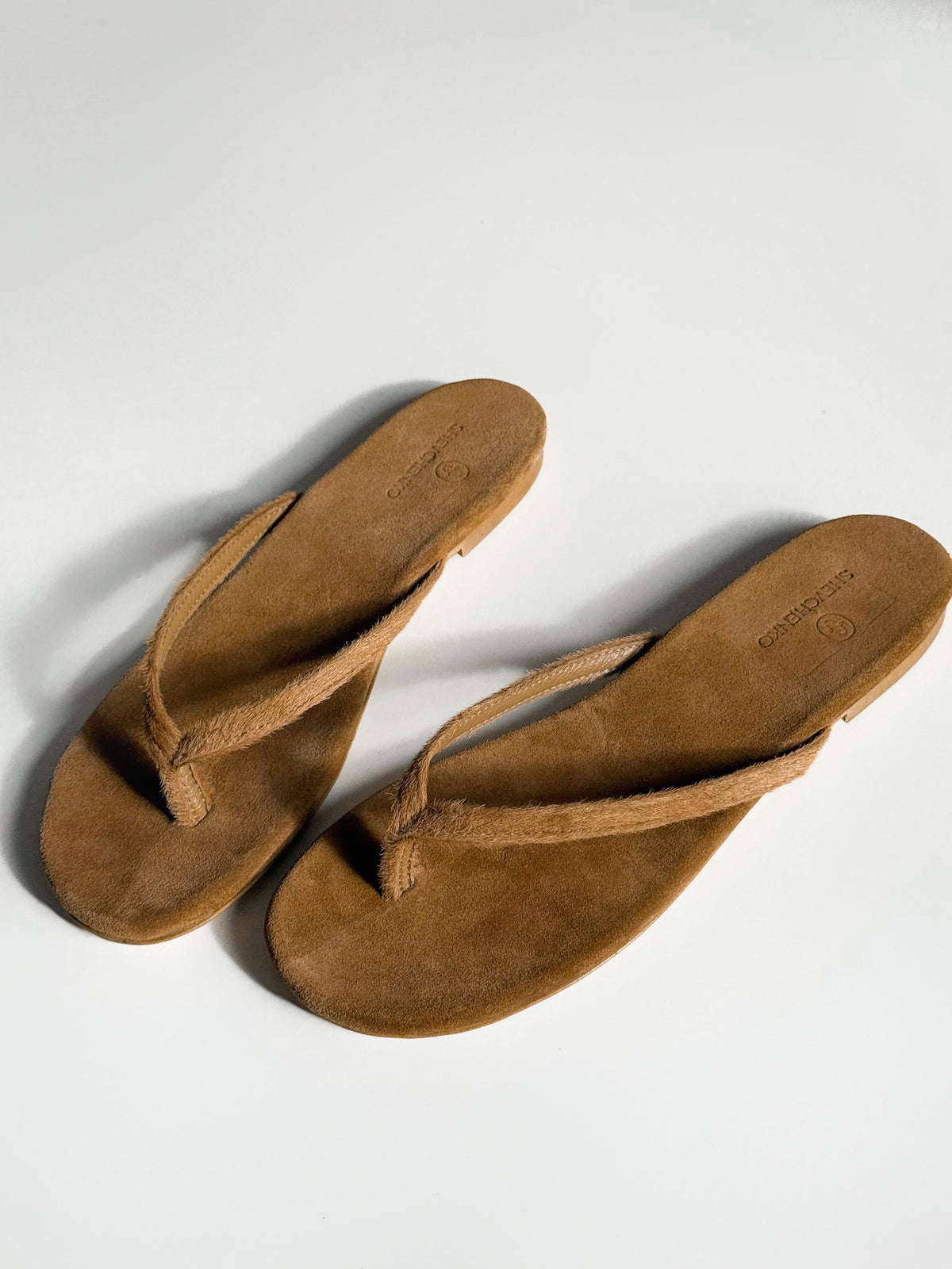 Pony-Effect Genuine Leather Flip-Flops, Caramel — front — SHEVCHENKO